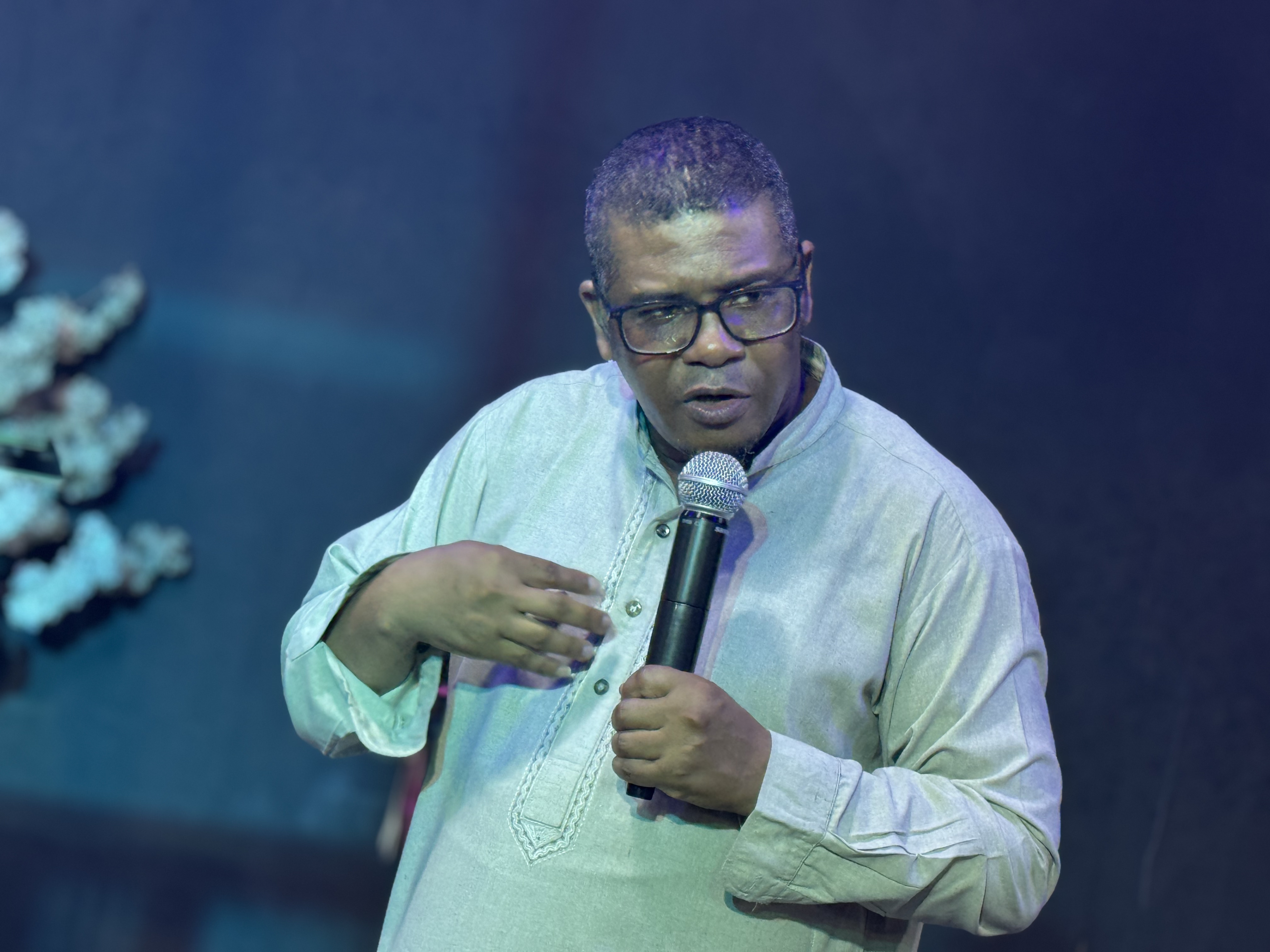 Damion Bennett speaking on stage